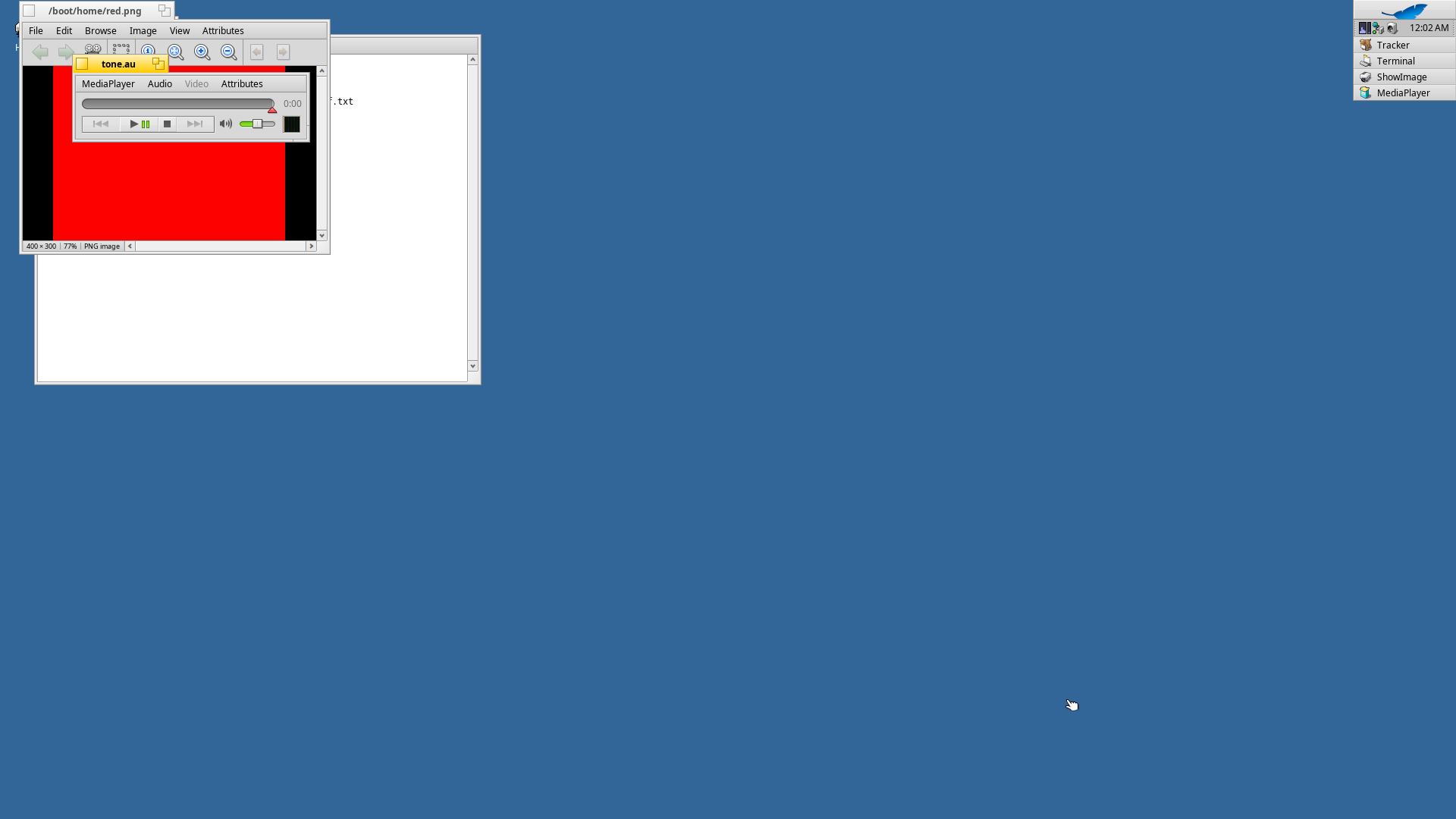 ShowImage, MediaPlayer and StyledEdit open together on the Haiku RISC-V desktop.